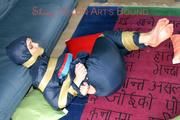 Jill tied, gagged and hooded on the floor with tape wearing an oldschool rain combination (Pics)