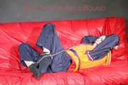 *** HOT HOT HOT*** NEW MODELL*** DESTINY wearing a sexy blue/red shiny nylon rain suit and a life jacket ties and gagges herself with cuffs on a sofa (Pics)