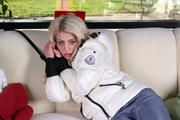 Nina bound in white downjacket and rainpants