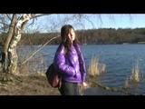 Alina walking in a lake wearing a supersexy purple down jacket and a jeans (Video)