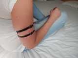 Tight little leather straps around Janes soft upper arms
