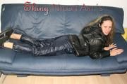 Petra lolling on the sofa wearing a sexy blue rainwear combination (Pics)