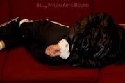 Samantha bound and gagged in shiny nylon rainwear
