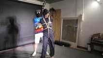Myxxxy bound and gagged in a shiny nylon Rainsuit