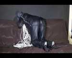 Watching Mara wearing sexy black rainwear during sorting her ropes for the next bondage session (Video)