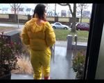 Jill wearing a yellow rain pants down jacket combination and rubber boots at home and outdoor (Video)