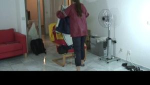 Brown-haired archive girl being at Alinas home wearing shiny nylon rainwear (Video)
