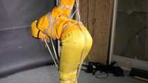 Marie tied and gagged in shiny nylon rainwear