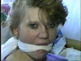22 Yr OLD LISA IS RUBBER BAND BALL-GAGGED, MOUTH STUFFED, HANDGAGGED, OTM & CLEAVE GAGGED (D43-6)