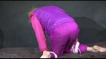 PIA tied and gagged with ropes and cloth gag on a sofa wearing an sexy oldschool purple/pink skisuit (Video)