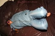 Katharina tied and gagged in a blue skisuit