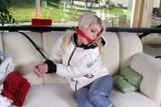 Nina bound in white downjacket and rainpants
