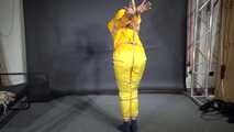 Marie tied and gagged in shiny nylon rainwear