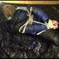 Pia tied, gagged and hooded lying on a bed with shiny nylon cloth wearing a sexy black adidas nylon pants and a blue down jacket(Video)
