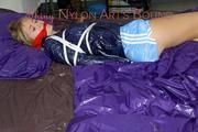 Samantha tied and gagged wearing a beautiful lightblue nylon shorts and a darkblue rain jacket (Pics)