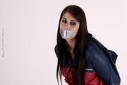 Shelly bound and gagged in shiny nylon rainwear