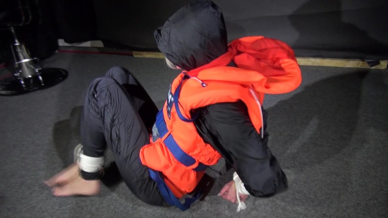 Sonja Being Tied, Gagged And Hooded On The Floor With Ropes And A Clothgag Wearing Sexy Shiny Nylon Rainwear And A Lifevest (Video)