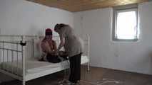 Lana roped on bed 1