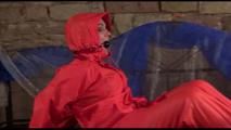 Jill tied, gagged and hooded on a princess bed wearing shiny orange rainwear (Video)