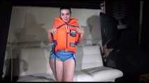 Sexy Jill shows you how to enjoy putting on and wear a lifevest over an bikini and a shiny nylon shorts (Video)