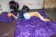 Samantha tied and gagged wearing a beautiful lightblue nylon shorts and a darkblue rain jacket (Pics)