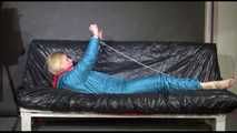 Pia ties and gagges herself with cuffs wearing a sexy green shiny nylon down suit (Video)