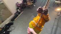Marie tied and gagged in shiny nylon rainwear