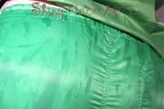 Sonja oiling and rinsing herself in the shower wearing a supersexy green shiny nylon shorts and rain jacket (Pics)