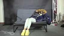 Marie bound and gagged in a shiny nylon Downjacket