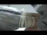 Simone  with an shiny silver PVC sauna suit tied and gagged by Sophie in an bath tub (Video)