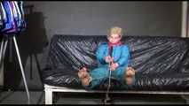 Pia ties and gagges herself with cuffs wearing a sexy green shiny nylon down suit (Video)