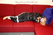 Samantha bound and gagged in shiny nylon rainwear
