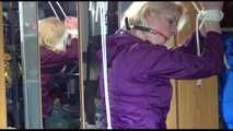 Pia tied with ropes overhead and gagged with a ballgag wearing sexy rain pants and a rain jacket (Video)