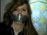 DOLL FACE APRIL TAPES UPS, GAGS & HANDCUFFS HERSELF (D20-11)