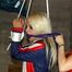 Nina tied and gagged in a shiny nylon skisuit