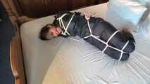 Rachel Adams tied and gagged in Rainwear