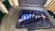 Lana tied and gagged in shiny nylon Rainwear desperately trying to free herself