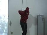 Video with one of our archive girls tied and gagged in shiny nylon rainwear