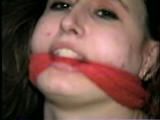 24 YEAR OLD ERICA IS MOUTH STUFFED, CLEAVE GAGGED, ROPE GAGGED & BALL-TIED WITH BLACK ELECTRICAL TAPE ON THE FLOOR (D51-16)