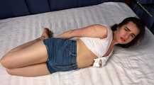 Doris hogtied on bed