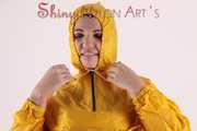 Watching sexy Jill wearing a sexy yellow shiny nylon rainwearcombination and a red shiny nylon raincoat posing for you (Pics)