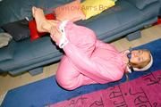Katharina tied and gagged in shiny nylon ski suit