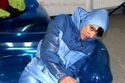 Simone tied and gagged in a shiny nylo skisuit
