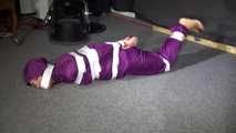 Sexy Sandra wearing a supersexy purple shiny nylon rainsuit bein tied and gagged and hooded on the floor with tape (Video)