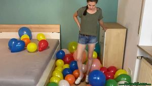 stomp2pop the balloons with her clogs shoes