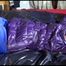 Sonja tied, gagged and hooded with cuffs on a bed wearing a sexy black blue pants and a purple down jacket (Video)