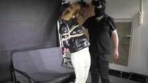 Marie bound and gagged in a shiny nylon Downjacket