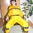 Jill tied, gagged and hooded with a tension belt on a chair wearing a supersexy yellow shiny nylon rainpants and rain jacket (Pics)