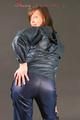 Alina posing in a studio wearing a supersexy darkblue rainwear combination (Pics)