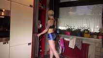 Watching sexy COURTNEY wearing a darkblue shiny nylon shorts and a top while preparing coffee and doing her housework (Video)